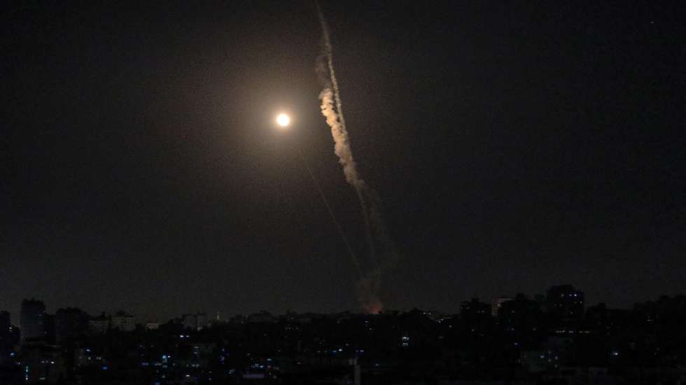 epa09210653 A rocket fired from Gaza flies towards Israel, in Gaza City, 18 May 2021. In response to days of violent confrontations between Israeli security forces and Palestinians in Jerusalem, various Palestinian militants factions in Gaza launched rocket attacks since 10 May that killed at least 12 Israelis to date. The Palestinian health ministry said that at least 213 Palestinians, including 61 children, were killed in the retaliatory Israeli airstrikes.  EPA/MOHAMMED SABER