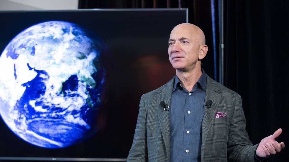 epa09252852 (FILE) - Founder and CEO of Amazon Jeff Bezos participates in the unveiling of an Amazon environmental initiative entitled 'The Climate Pledge', in Washington, DC, USA, 19 September 2019 (reissued 07 June 2021). Outgoing Amazon CEO Jeff Bezos via social media on 07 June 2021 announced he and his brother will be on Bezos's space company Blue Origin's first crewed space flight. The lflight is scheduled for 20 July 2021.  EPA/MICHAEL REYNOLDS *** Local Caption *** 56666667