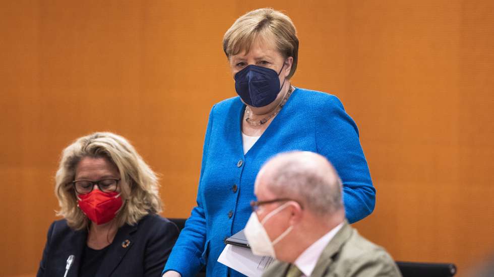 epa09312712 German Chancellor Angela Merkel (C) arrives for the weekly government cabinet meeting in Berlin, Germany, 30 June 2021. Germany has eliminated many of its pandemic lockdown measures as coronavirus disease (COVID-19) infection rates have plummeted nationwide to single digits and over 50 percent of the population has received a first dose of a vaccine. However authorities are becoming increasingly concerned over a possible fourth wave brought on by the spread of the Delta variant.  EPA/MAJA HITIJ / POOL
