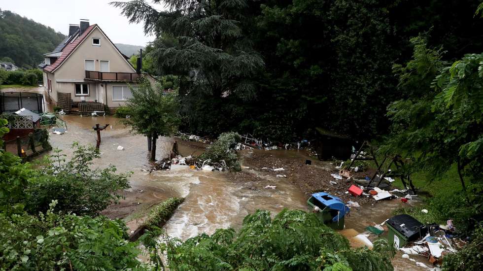 epa09343914 A flooded backyard of an evacuated retirement home as heavy rain hits Hagen, Germany, 14 July 2021. Large parts of North Rhine-Westphalia were hit by heavy, continuous rain Tuesday evening. According to the German Weather Service (DWD), the rain is not expected to let up until 15 July. The Rhine level has risen significantly in recent days.  EPA/FRIEDEMANN VOGEL