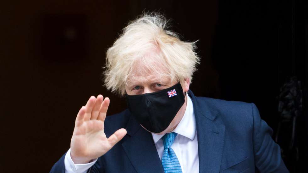 epa09343732 British Prime Minister Boris Johnson departs 10 Downing Street for Prime Minister Questions at parliament in London, Britain, 14 July 2021. Johnson faces the MPs' weekly question time in the House of Commons.  EPA/VICKIE FLORES