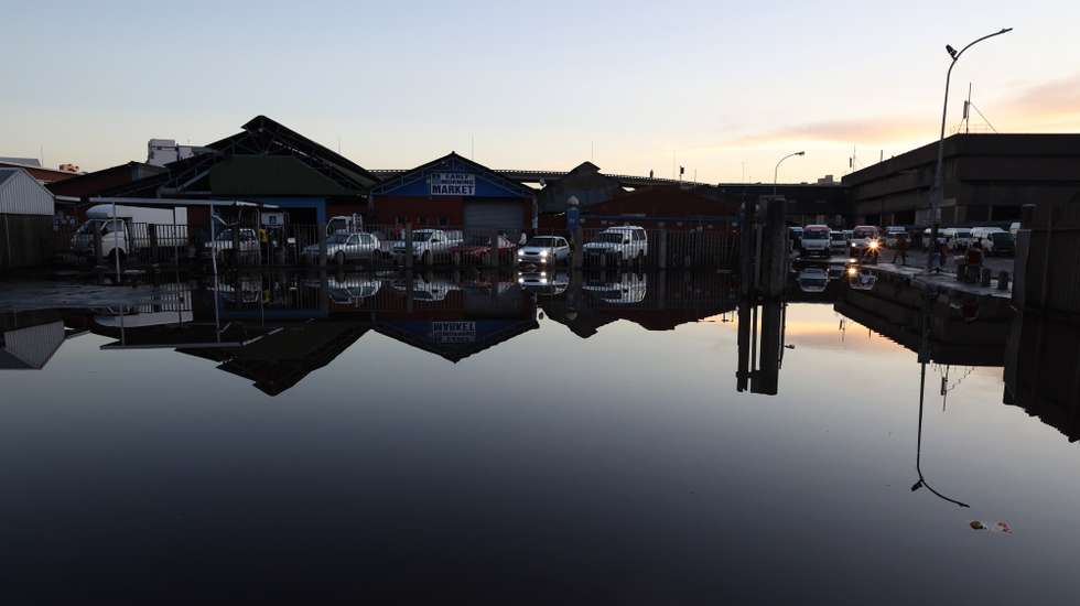 epa09887995 Flood waters remain in low lying areas of the city days after the worst flooding in 60 years hit Durban, South Africa, 13 April 2022. At least 250 people have died as a result of heavy flooding in the Eastern Coastal area. Key roads in the area have been damaged and mudslides destroyed houses. The South African National Defense Force have been called in to assist as President Cyril Ramaphosa visited the area on 13 April.  EPA/STR