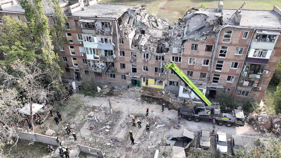 epa10240531 A handout photo released by the press service of the State Emergency Service (SES) of Ukraine shows a residential building damaged by shelling, in Mykolaiv, southern Ukraine, 13 October 2022, amid Russia's invasion. Mykolaiv was hit by rocket attacks with one of them hitting a residential building in a district of the city. At least two people died and five others were reported trapped under the rubble, SES said on 13 October. Russian troops entered Ukraine on 24 February 2022 starting a conflict that has provoked destruction and a humanitarian crisis.  EPA/STATE EMERGENCY SERVICE OF UKRAINE HANDOUT -- BEST QUALITY AVAILABLE -- MANDATORY CREDIT: STATE EMERGENCY SERVICE OF UKRAINE -- HANDOUT EDITORIAL USE ONLY/NO SALES