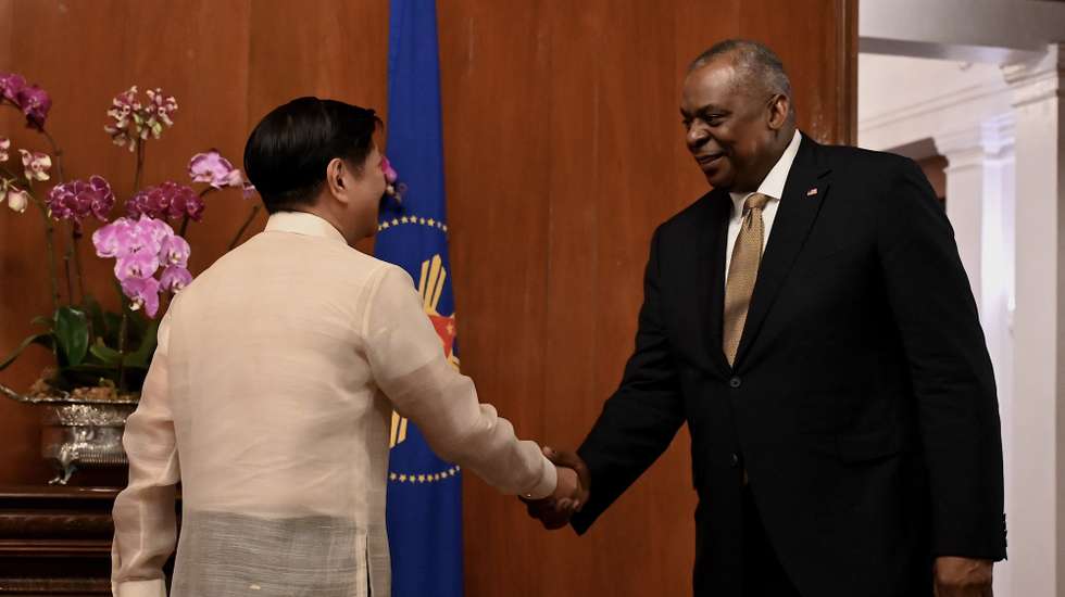 epa10443741 United States Defense Secretary Lloyd Austin (R) greets Philippine President Ferdinand Marcos Jr. (L), at the presidential palace in Manila, Philippines 02 February 2023. Austin is visiting Manila for meetings with Philippine officials in efforts to boost bilateral ties between the two countries.  EPA/JAM STA. ROSA/POOL