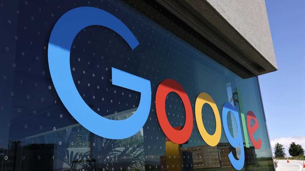 epa09952080 Google logo and binary code on the window of Google's new Bay View campus building, BV100  and during a media tour in Mountain View, California, USA, 16 May 2022. Google announced on 16 May the opening of its new Bay View campus in Silicon Valley, representing the company's first time developing its own major campus and the largest to pursue multiple green building certifications. The Bay View campus was designed by architects Bjarke Ingels Group (BIG) and Heatherwick Studio, as well as Google's design and engineering teams and spans 42 acres adjacent to the open space, two office buildings, and 1,00-person event center, and 240 short-term employee accommodations units. The campus incorporates biophilic design principles, including greenery, natural daylight and views outside from every desk to improve the health and wellbeing of those inside the building. The new building is to operate every hour of every day on carbon-free energy by 2030, the first-of-its-kind dragonscale solar skin, as well as nerby wind farms, will power Bay View on carbon-free energy 90 percent of the time. Bay View is 100 percent electric where even the kitchens are electric to decrease carbon emissions. To help deliver on its commitment to replenish 120 percent of the water it comsumes by 2023, the site is net water-positive with all non-potable water demands being met using the recycled water it generates on site. A series of above-ground ponds gather rainwater, combine with building wastewater treatment systems, together serve as a water source for cooling towers, flushing toilets, and landscape irrigation.  EPA/JOHN G. MABANGLO