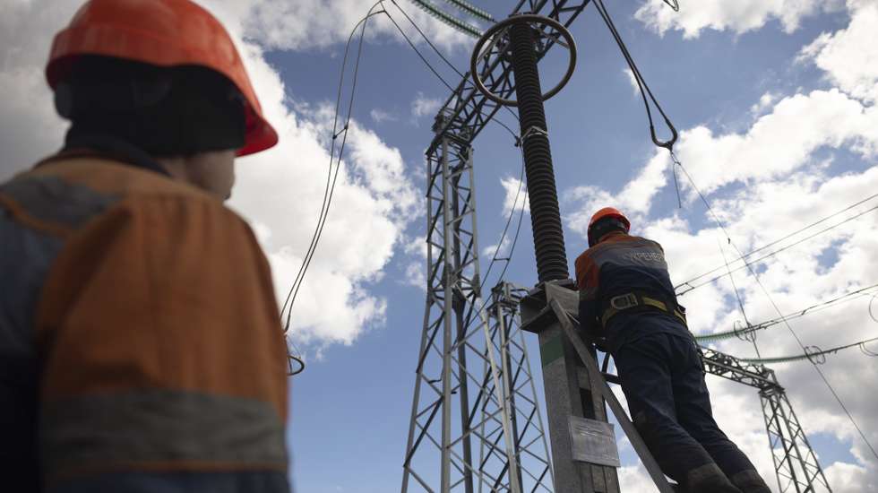 epa10545625 Workers repair an energy infrastructure facility which was damaged in a missile strike during repair works at an undisclosed location in northern Ukraine, 27 March 2023. Continuous Russian missile strikes have been targeting points of energy infrastructure across Ukraine since Fall 2022 amid the Russian invasion.  EPA/STANISLAV KOZLIUK