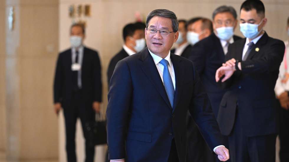 epa10711868 Chinese Premier Li Qiang attends a bilateral meeting with Director-General of the World Trade Organization Ngozi Okonjo-Iweala ahead of the annual World Economic Forum New Champions meeting, in Tianjin, China, 26 June 2023.  EPA/WANG Zhao / POOL