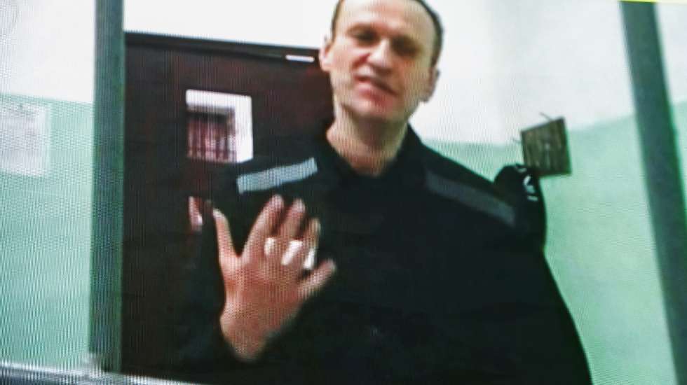 epa10705296 Russian opposition figure Alexei Navalny is seen on a screen via a video link from his penal colony during a hearing about his right to correspond while in jail, at the Russian Supreme court in Moscow, Russia, 22 June 2023.  The Supreme Court of the Russian Federation recognized as lawful the internal regulations of correctional institutions on the issuance of writing materials to persons held in punishment cells. Navalny has been in the colony since February 2021, when the court, at the request of the Federal Penitentiary Service, replaced his suspended sentence in the Yves Rocher case of 2014 with a real one. He was supposed to serve in a penal colony for 2 years and 8 months, but in March 2022, the Lefortovo Court of Moscow, at an off-site meeting in correctional colony-2 in the city of Pokrov, Vladimir Region, sentenced the politician to 9 years of strict regime and a fine of 1.2 million rub., as well as one and a half years of restriction of freedom in the case of fraud and contempt of court. In June 2022, the sentence entered into force.  EPA/SERGEI ILNITSKY