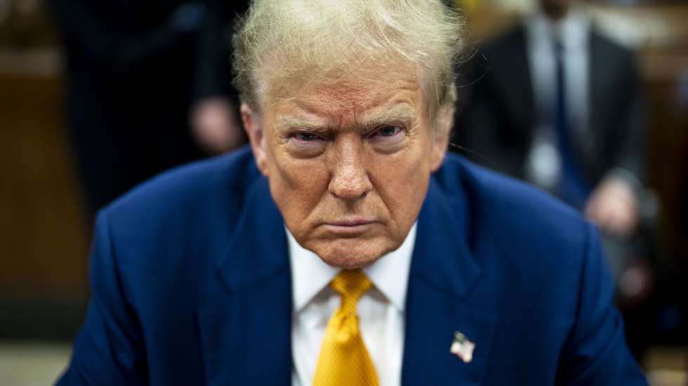 epa11315411 Republican presidential candidate, former US President Donald Trump awaits the start of proceedings in his criminal trial at the New York State Supreme Court in New York, USA, 02 May 2024. Trump is facing 34 felony counts of falsifying business records related to payments made to adult film star Stormy Daniels during his 2016 presidential campaign.  EPA/DOUG MILLS / POOL