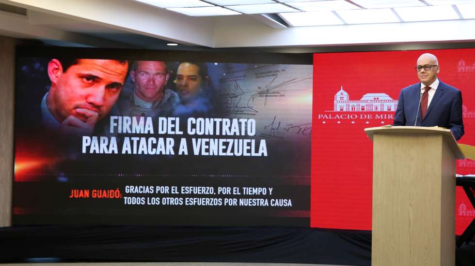 epa08403756 A handout photo made available by Miraflores Presidential Palace shows the Venezuelan Minister of Comunications Jorge Rodriguez reading a statement at the presidency headquarter in Caracas, Venezuela, 05 May 2020. Venezuelan Governement released an audio recording which allegedly link to the Venezuelan opposition leader and head of parliament, Juan Guaido, with the alleged attempt of a maritime invasion on the coast near Caracas. The opposition described the operation as a set-up.  EPA/MIRAFLORES PRESIDENTIAL PALACE HANDOUT  HANDOUT EDITORIAL USE ONLY/NO SALES