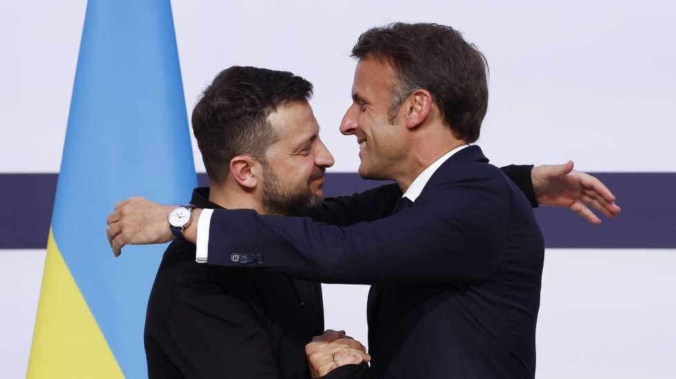 epa11396344 French President Emmanuel Macron (R) greets Ukrainian President Volodymyr Zelensky (L) during a joint press conference at the Elysee Palace in Paris, France, 07 June 2024. Zelensky arrived in France on 06 June to attend commemorations of the 80th anniversary of D-Day in Normandy.  EPA/YOAN VALAT / POOL