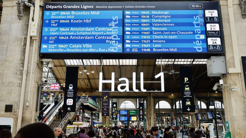 epa11496928 Stranded passengers wait inside Gare du Nord station in Paris, France, 26 July 2024. France's high speed rail network TGV was severely disrupted on 26 July following a 'massive attack', according to train operator SNCF, just hours before the opening ceremony of the Paris 2024 Olympic games. French Transport Minister Patrice Vergriete condemned 'these criminal actions' saying that they would 'seriously disrupt traffic' until this weekend. Around 800,000 passengers are expected to be affected over the weekend.  EPA/RITCHIE B. TONGO