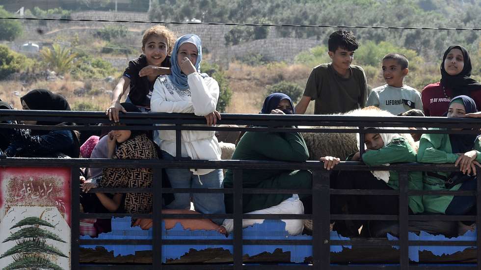 epa11622225 Lebanese people, who are fleeing southern Lebanon, travel with their belongings towards Beirut along the Damour highway, Lebanon, 24 September 2024. Thousands of people fled southern Lebanon after an evacuation warning by the Israeli army, which on 23 September announced that it had launched 'extensive' airstrikes on Hezbollah targets in the country. According to Lebanon's Ministry of Health, at least 558 people have been killed and more than 1,835 have been injured following continued airstrikes on southern Lebanese towns and villages.  EPA/WAEL HAMZEH