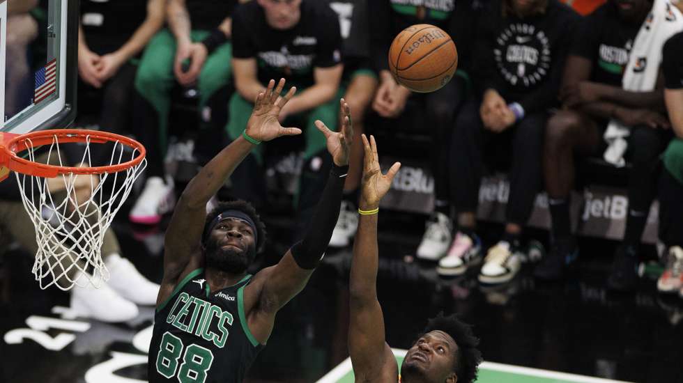 epa11717492 Boston Celtics center Neemias Queta (L) and Atlanta Hawks center Clint Capela (R) reach for the loose ball during the first half of the NBA In-Season Tournament game between the Boston Celtics and the Atlanta Hawks in Boston, Massachusetts, USA, 12 November 2024.  EPA/CJ GUNTHER SHUTTERSTOCK OUT