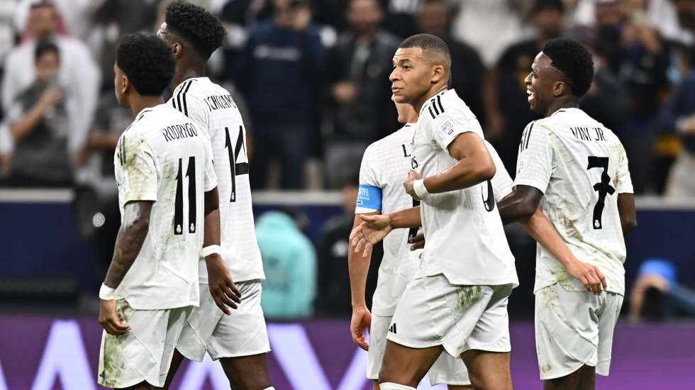 epa11784255 Kylian Mbappe (C) of Real Madrid celebrates with teammates after scoring during the FIFA Intercontinental Cup 2024 final match between Real Madrid and Pachuca in Lusail, Qatar, 18 December 2024.  EPA/NOUSHAD THEKKAYIL