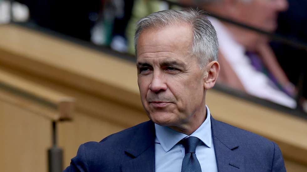 epa11470271 Former head of the Bank of England Mark Carney arrives at Centre Court for the Women's quarter final between Elena Rybakina of Kazakhstan and Elina Svitolina of Ukraine at the Wimbledon Championships, Wimbledon, Britain, 10 July 2024.  EPA/NEIL HALL  EDITORIAL USE ONLY