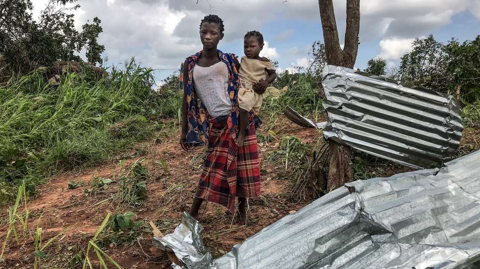 epa09822031 A local woman inspects the damages to the houses destroyed by Cyclone Gombe, Topelane neighborhood, Monapo village, Nampula province, Mozambique, 13 March 2022. Storm Gombe reached the Mozambican coast in the early hours of 11 March morning in the category of an intense cyclone with torrential rain and wind of 165 kilometers per hour, with gusts exceeding 200 km/hour.  EPA/ANDRE CATUEIRA