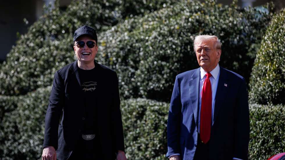 epa11957120 US President Donald Trump (R) speaks in front of a group of Tesla vehicles with Tesla CEO and Senior Advisor to the President of the United States Elon Musk (L) and his son, X, on the South Lawn of the White House in Washington, D.C., USA, 11 March 2025. President Trump has said he will buy a Tesla to support Tesla and Elon Musk after recent attacks on Tesla charging stations and calls for boycotts of Tesla products.  EPA/SAMUEL CORUM / POOL