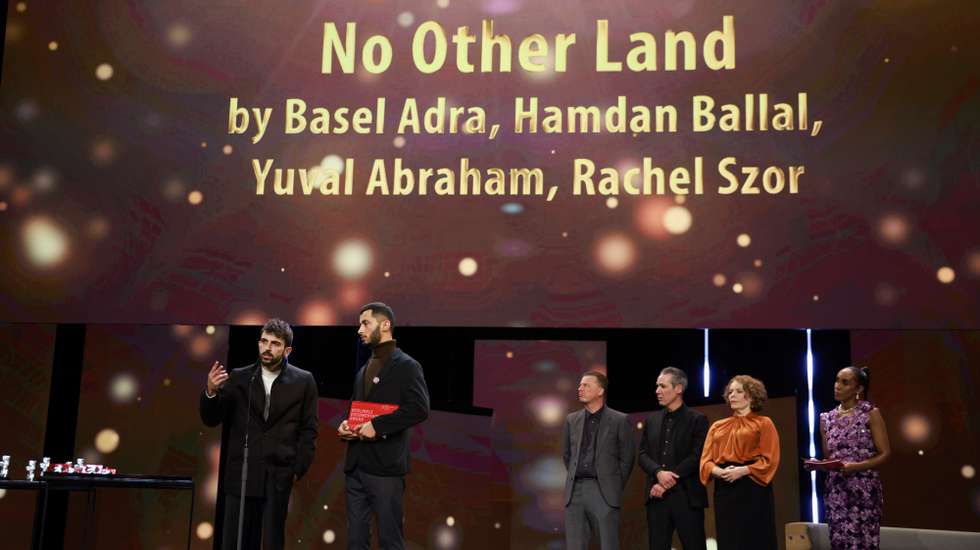 epa11178805 Basel Adra and Yuval Abraham receive the Berlinale documentary award for the movie "No Other Land" during the award ceremony 74th Berlin International Film Festival 'Berlinale' in Berlin, Germany, 24 February 2024.  EPA/CLEMENS BILAN