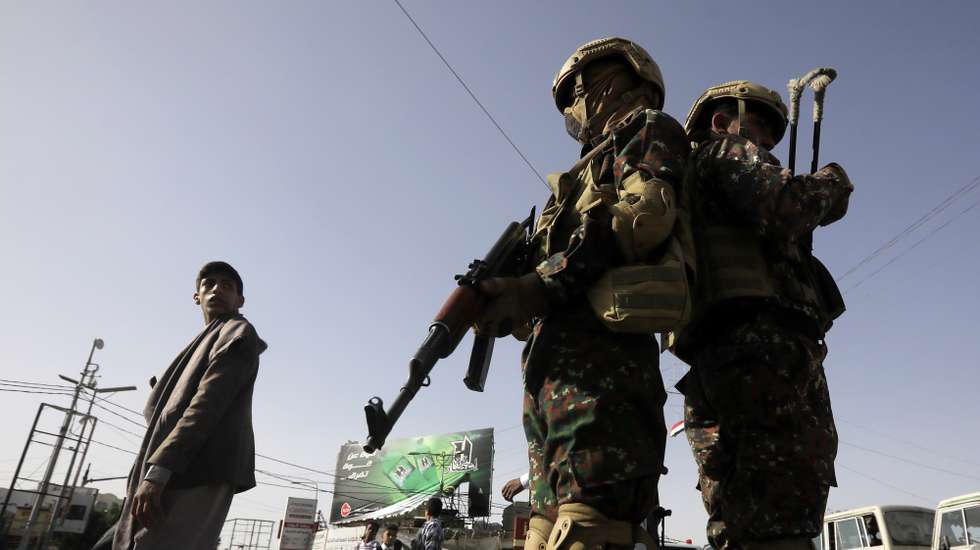 epa12108053 Houthi soldiers patrol a street in Sana'a, Yemen, 16 May 2025. At least one person was killed and nine others wounded in Israeli airstrikes on two Houthi-controlled Red Sea ports in Yemen in response to the escalation of Houthi missile-drone attacks on Israel, the Houthi-controlled Health Ministry reported.  EPA/YAHYA ARHAB