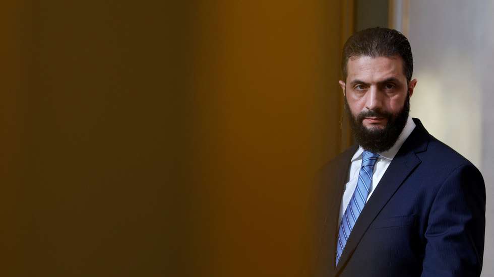 epa12081463 Syrian President Ahmed al-Sharaa listens to French President Emmanuel Macron's (not pictured) speech during a joint press conference after their meeting at the Elysee Palace in Paris, France, 07 May 2025.  EPA/STEPHANIE LECOCQ / POOL