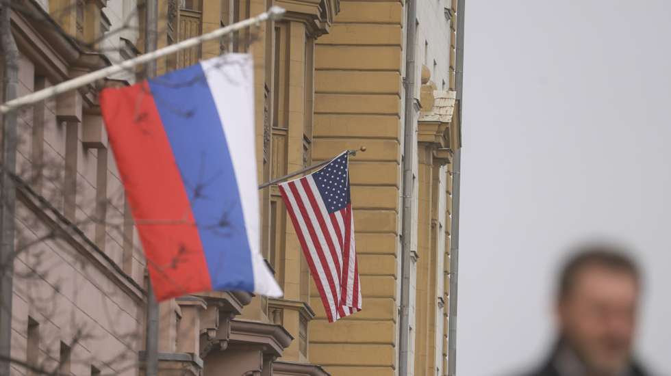 epaselect epa11958141 A man walks near Russian (front) and US flags hanging on the main building of the US Embassy in Moscow, Russia, 12 March 2025. The Kremlin expects the US to inform Russia about the results of the US-Ukrainian talks in Jeddah, and does not rule out a telephone conversation between Presidents Vladimir Putin and Donald Trump, said Dmitry Peskov, the press secretary of the head of the Russian state. As a result of the talks between the American and Ukrainian sides in Saudi Arabia, Kyiv agreed to a 30-day truce in the conflict in Ukraine.  EPA/SERGEI ILNITSKY