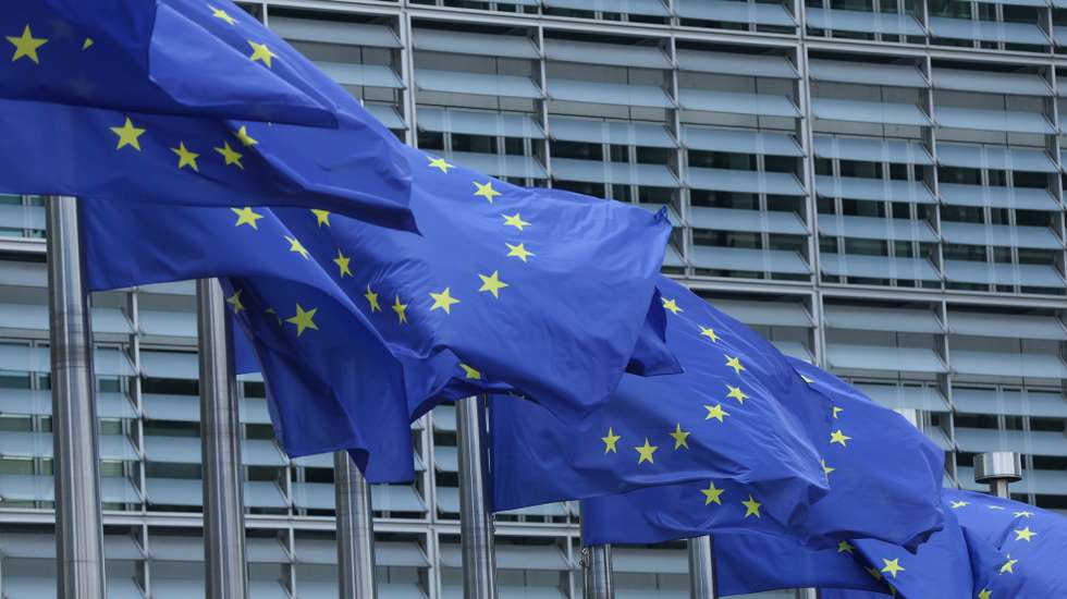 epa12276806 European Union flags at the European commission headquarters in Brussels, Belgium, 01 August 2025. U.S. President Donald Trump signed an executive order imposing tariffs of 15 percent on most EU goods and up to 41 percent to other countries. The tariffs take effect on 07 August 2025, a one-week delay to allow more time for negotiations.  EPA/OLIVIER HOSLET