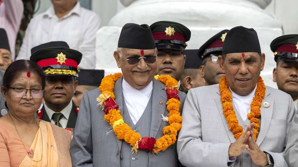 epa12357146 Nepalese Prime Minister K. P. Sharma Oli (C) takes part in celebrations during the Indra Jatra festival at the Basantapur Durbar Square in Kathmandu, Nepal, 06 September 2025. Indra Jatra is an eight-day festival dedicated to the Hindu god of rain and the king of heaven, Indra, marked with traditional masked dances, a chariot procession and rituals honoring family members deceased in the past year.  EPA/NARENDRA SHRESTHA
