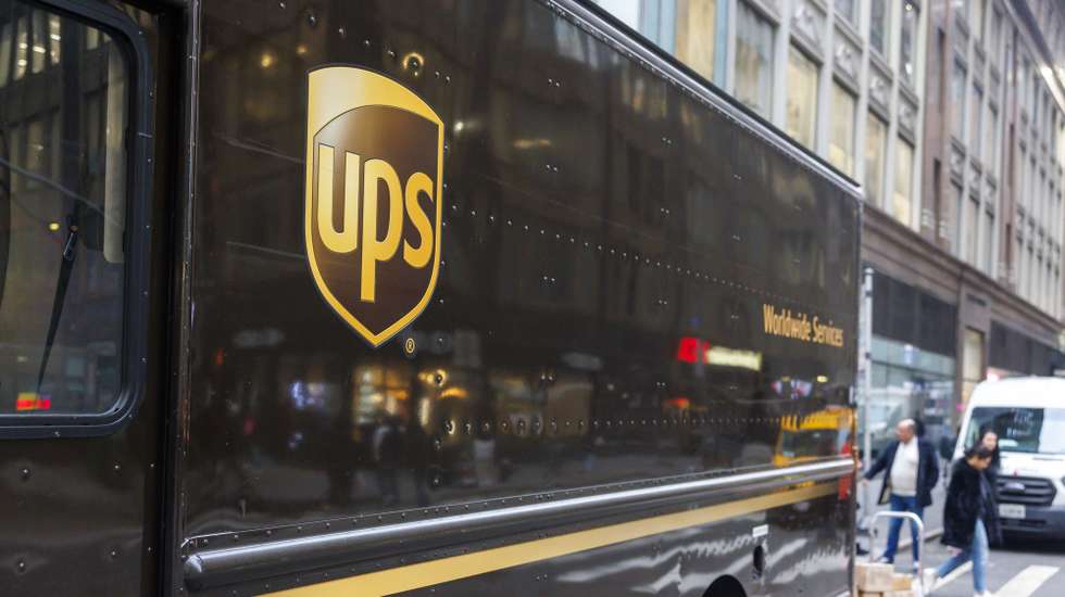 epa11114770 A United Parcel Service (UPS) truck sits on a street in New York, New York, USA, 30 January 2024. UPS announced Tuesday 30 January that it will cut 12,000 jobs in 2024, mostly for management staff and contract workers, according to UPS executives.  EPA/SARAH YENESEL
