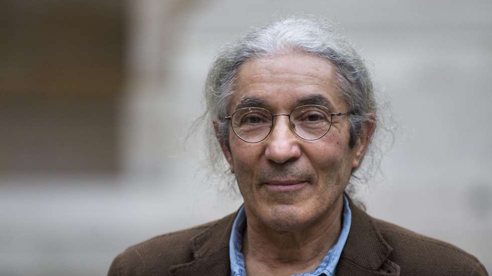 epa05002428 The laureate of the French Academy Literary Prize 2015, Algerian author Boualem Sansal for his novel '2084' poses at the French Academy in Paris, France, 29 October 2015. The French Academy Literary Prize celebrates its 100 years of existence.  EPA/ETIENNE LAURENT