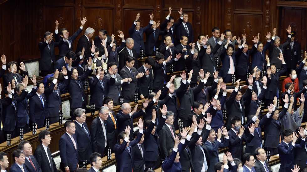 epa12673248 Lawmakers raise their arms shouting 'Banzai' after the announcement of the dissolution of the lower house of the parliament, in Tokyo, Japan, 23 January 2026. Japanese Prime Minister Sanae Takaichi called for a snap general election set for 08 February 2026.  EPA/FRANCK ROBICHON