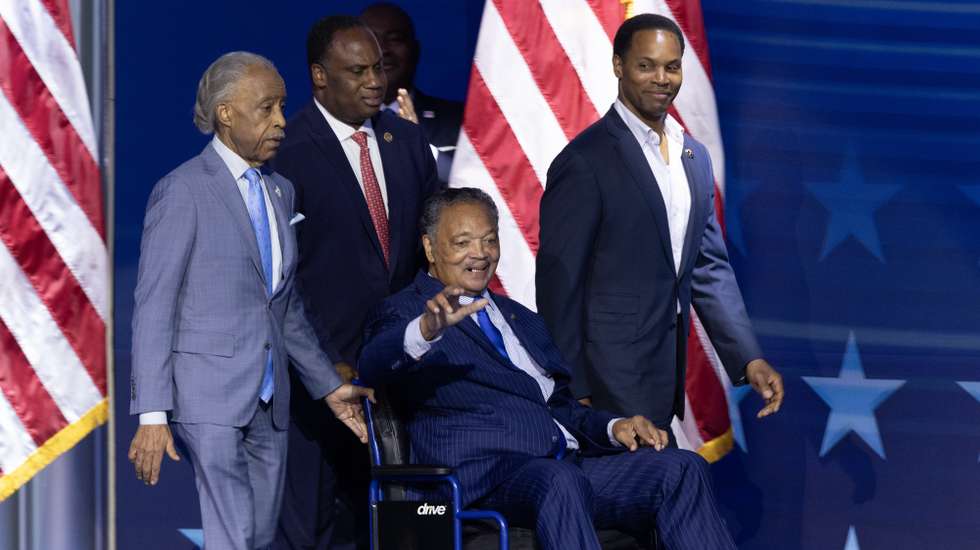epa11555769 Civil rights activists Jesse Jackson (C) and Al Sharpton (L) walk onto the stage during the opening night of the Democratic National Convention (DNC) at the United Center in Chicago, Illinois, USA, 19 August 2024. The 2024 Democratic National Convention is being held from 19 to 22 August 2024, during which delegates of the United States' Democratic Party will vote on the party's platform and ceremonially vote for the party's nominee for president, Vice President Kamala Harris, and for vice president, Governor Tim Walz of Minnesota, for the upcoming presidential election.  EPA/MICHAEL REYNOLDS