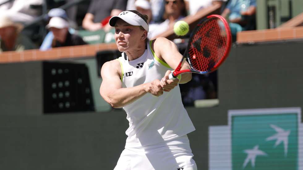 epa12824688 Elena Rybakina of Kazakhstan in action during the women’s singles finals match against Aryna Sabalenka of Belarus on day 12 of the BNP Paribas Open tennis tournament in Indian Wells, California, USA, 15 March 2026.  EPA/JOHN G. MABANGLO