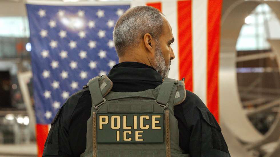 epa12844849 A US Immigration and Customs Enforcement (ICE) agent patrols the John F. Kennedy International Airport, amid congestion caused by the Department of Homeland Security (DHS) shutdown, in the Queens borough of New York, New York, USA, 23 March 2026. ICE agents have begun deploying to major US airports to assist the Transportation Security Administration (TSA) as a partial government shutdown triggers widespread security checkpoint delays. With the Department of Homeland Security (DHS) facing a funding lapse, TSA screeners and thousands of other federal employees are currently working without pay.  EPA/OLGA FEDOROVA
