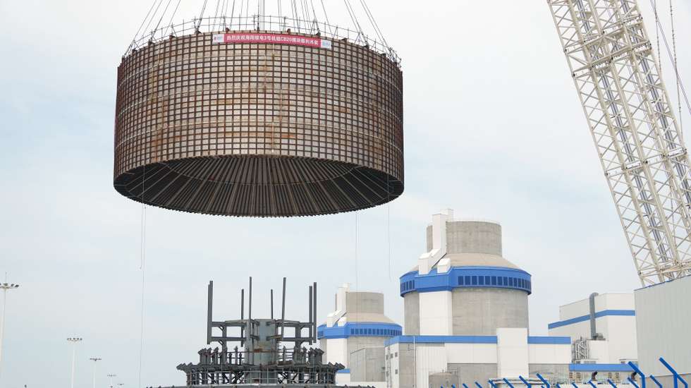 epa12283034 A crane lifts the CB20 module of the nuclear island for the 3rd unit of the Haiyang Nuclear Power Plant in Haiyang, Shandong Province, China, 04 August 2025. The CB20 module was successfully lifted and positioned, marking the completion of all major module installations for the 3rd unit of the Haiyang Nuclear Power Plant and the start of equipment installation and commissioning phase.  EPA/XINHUA / Tang Ke CHINA OUT / UK AND IRELAND OUT  /       MANDATORY CREDIT EDITORIAL USE ONLY