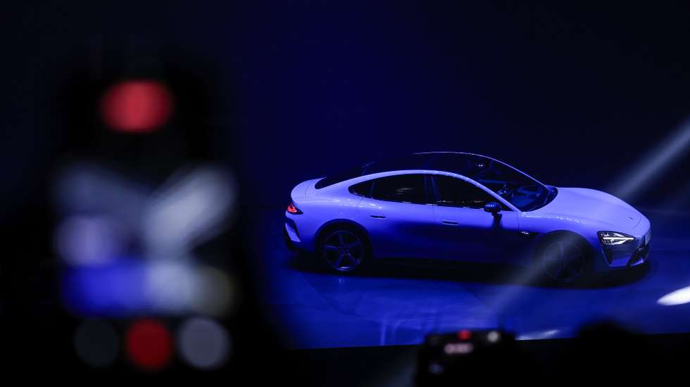 epa12833142 Visitors attend the launch of the new-generation Xiaomi SU7 electric car in Beijing, China, 19 March 2026.  EPA/WU HAO