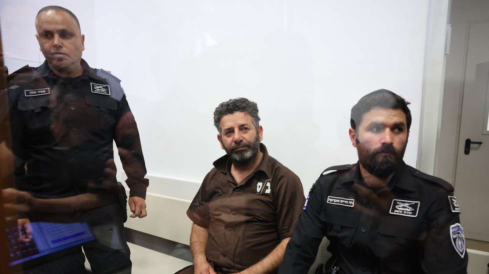epa12929417 Saif Abu Keshek (C), a member of the Global Sumud Flotilla, arrives to attend his trial for a remand extension at the Ashkelon Magistrate's Court in Ashkelon, Israel, 03 May 2026. Abu Keshek along with Thiago Avila were arrested on 02 May off the island of Crete, according to the organization. According to the Israeli Ministry of Foreign Affairs, Abu Keshek is suspected of affiliation with a terrorist organization, and Avila of illegal activity.  EPA/ABIR SULTAN