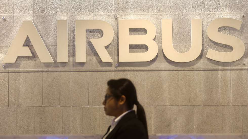 epa12799437 A person walks in front of the Airbus logo at the newly inaugurated Airbus India Technology Centre in Bangalore, India, 06 March 2026. The French aerospace company Airbus inaugurates its new India Technology Centre in Bengaluru, a 13-floor, 880,000 sq. ft. facility designed to accommodate about 5,000 employees, marking a major expansion. The new facility serves as a hub for engineering, digital transformation, customer services, and its strategic footprint in India, and is the largest fulfilment office in Bangalore.  EPA/JAGADEESH NV