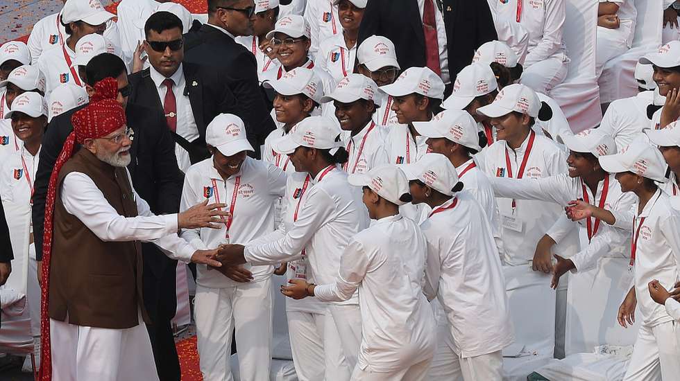 epa13170563 Indian Prime Minister Narendra Modi (L) greets school children after addressing the nation during Independence Day celebrations at the Red Fort in New Delhi, India, 15 August 2026. Modi hoisted the national flag at the 17th-century monument and addressed the nation, marking 80 years of Indian independence from British colonial rule since 1947.  EPA/RAJAT GUPTA
