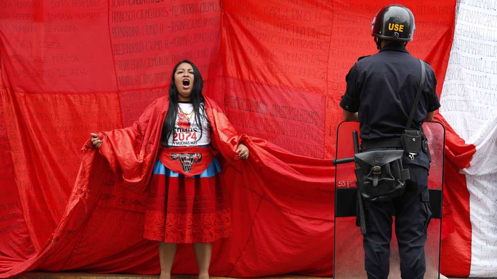 epaselect epa08058047 Sara Paredes, along with other women victims of forced sterilizations during the term of former President Alberto Fujimori, protest outside the Superior Court of Justice for the postponement of the judicial hearing, in Lima, Peru, 09 December 2019. The court hearing where the Prosecutor's Office was to present its accusation to Fujimori and his former health ministers for crimes against humanity was postponed until 20 March 2020, which outraged the victims, mostly women, and organizations that carry their defense.  EPA/Paolo Aguilar
