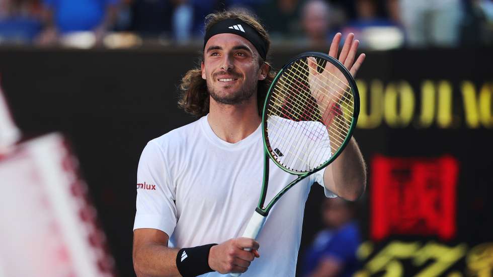 epa10432852 Stefanos Tsitsipas of Greece celebrates after winning the semi final match against Karen Khachanov of Russia at the Australian Open tennis tournament in Melbourne, Australia 27 January 2023.  EPA/FAZRY ISMAIL