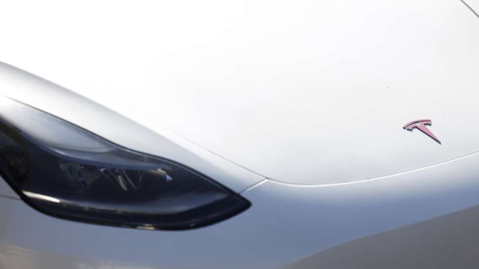epa11861429 A logo is displayed on a Tesla car that is parked outside of a Tesla showroom in Burbank, California, USA, 29 January 2025. Tesla is set to report its fourth-quarter earnings after the close of the US stock market.  EPA/CAROLINE BREHMAN