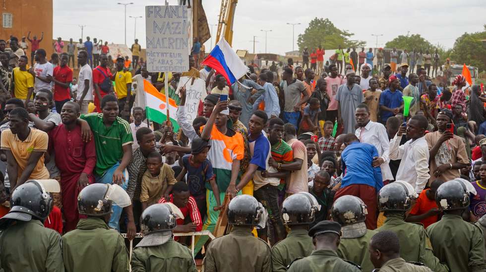 epa10836885 Supporters of the military junta protest against the French military presence at the roundabout leading to the French base in Niamey, Niger, 02 September 2023. Thousands of people gathered outside the base to ask the French troops to leave and accusing Paris of' 'blatant interference' by backing ousted President Bazoum.  EPA/ISSIFOU DJIBO