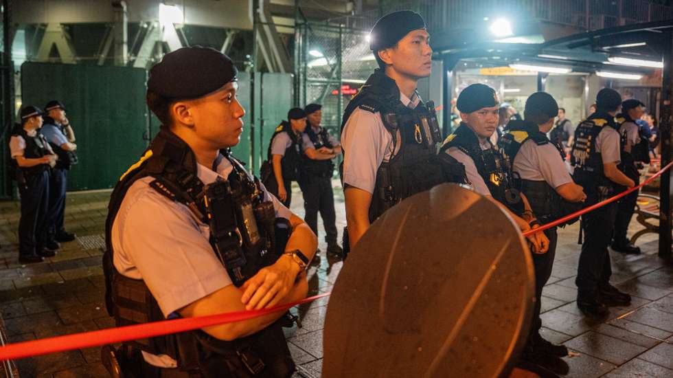 epa12155432 Police officers stand guard at Victoria Park in Hong Kong, China, 04 June 2025. Hong Kong's Victoria Park saw no commemorative events on the 36th anniversary of the Tiananmen crackdown, as the public commemoration of the 1989 Tiananmen Square protests is banned under the National Security Law passed in 2020.  EPA/LEUNG MAN HEI