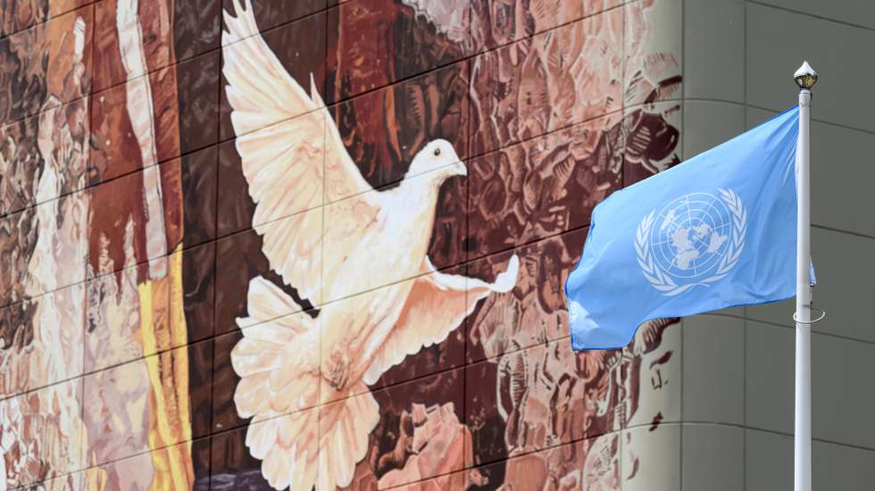 epaselect epa12192517 The flag of the United Nations (UN) flutters next to a mural depicting a white dove during the International Atomic Energy Agency (IAEA) Board of Governors meeting at the IAEA headquarters, in Vienna, Austria, 23 June 2025.  EPA/MAX SLOVENCIK