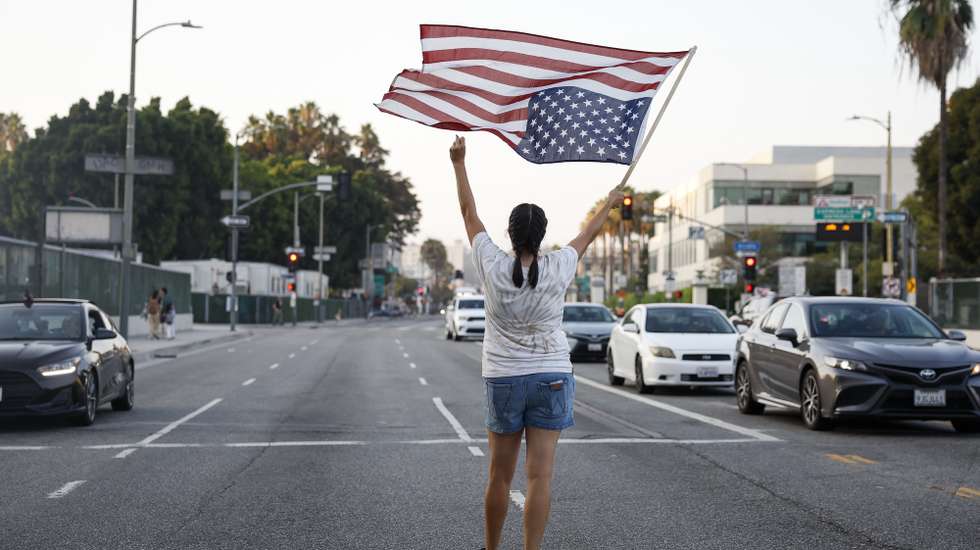 epa12296719 Demonstrators gather during a rally as part of a 'community strike' to protest federal immigration enforcement actions, in Los Angeles, California, USA, 12 August 2025.  EPA/CAROLINE BREHMAN