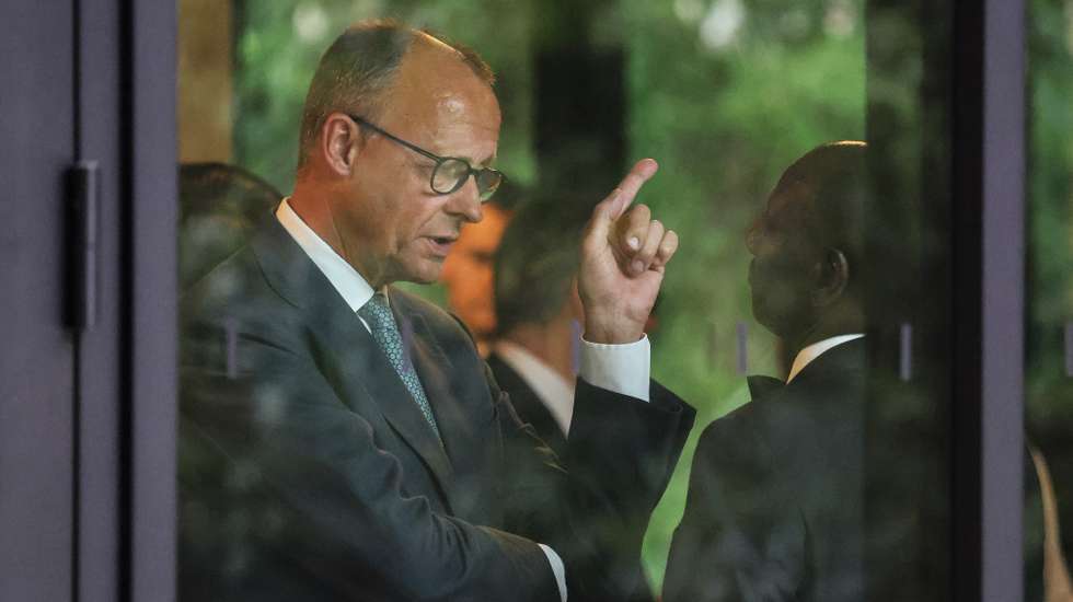 epa13042217 Germany's Chancellor Friedrich Merz (L) speaks with Kenya's President William Ruto before a group photo at the G7 summit in Evian-les-Bains, central-eastern France, 16 June 2026. The 52nd G7 Summit takes place in Evian-les-Bains from 15 to 17 June 2026.  EPA/LUDOVIC MARIN / POOL  MAXPPP OUT