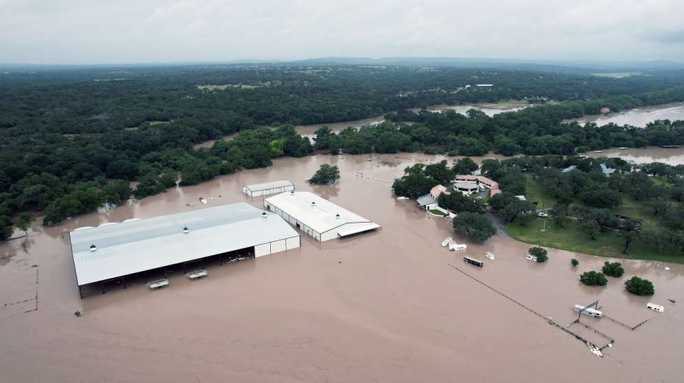 epa13116173 An aerial view taken with a drone shows floodwater at Corrival Horse Ranch near the Guadalupe River in Sisterdale, Texas, USA, 16 July 2026. Severe flooding affected parts of South-Central Texas and the Texas Hill Country, with a dangerous flood wave moving down the Guadalupe River, according to the National Weather Service.  EPA/DUSTIN SAFRANEK