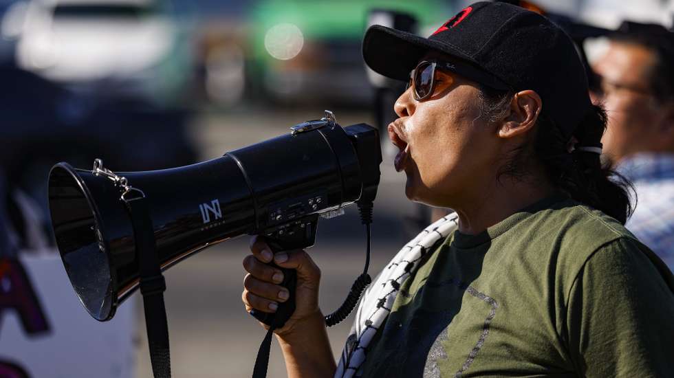 epa13116341 Members of Union del Barrio and the Community Self-Defense Coalition rally calling for justice in the deaths of Lorenzo Salgado Araujo and Johan Sebastian Duran Guerrero, and advocating for changes to federal immigration enforcement policies, at the intersection of Central and Vernon Avenue in South Central Los Angeles, California, USA, 16 July 2026.  EPA/CHRIS TORRES