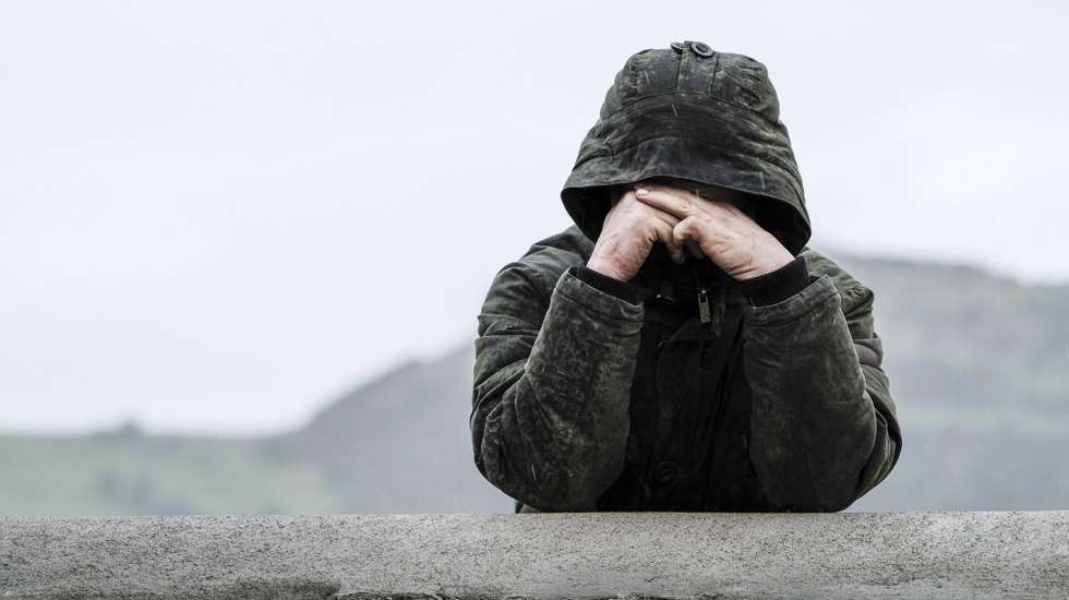 epa06468193 A man mourns in silence at the Funeral Mass of Dolores O'Riordan which took place at St Ailbe's Church, Ballybricken, Limerick, Ireland, 23 January 2018. Dolores O'Riordan has died in London on 15 January, aged 46.  EPA/DON MOLONEY
